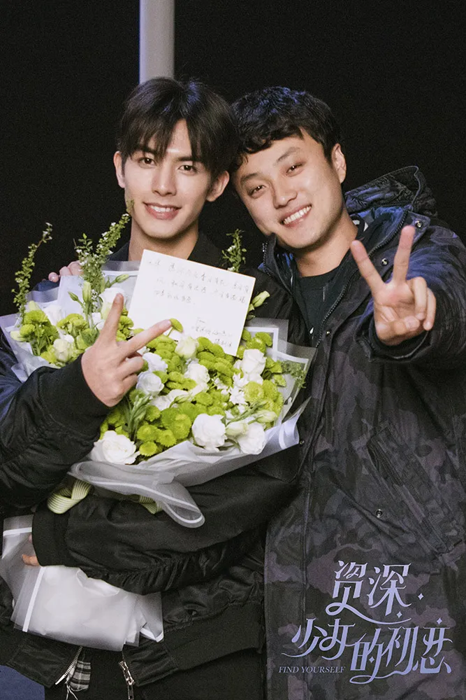 Song Weilong poses with director.jpg