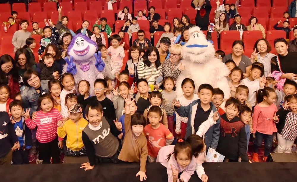 Children pose with snow monsters after the film. JPG